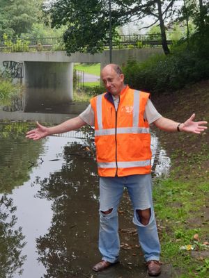 David Phillips at the flooded underpass between Mounway and Parkway in Brookside