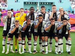 Supporting image for story: Germany players cover mouths for team photo in protest over OneLove armband ban