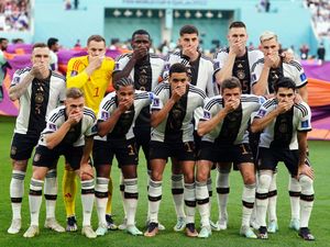 Supporting image for story: Germany players cover mouths for team photo in protest over OneLove armband ban