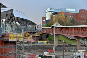 The new bridge under construction, with the old red bridge to the right