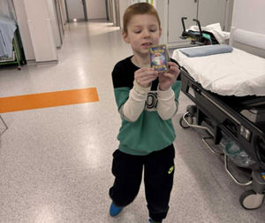 Dylan with his Pokémon card