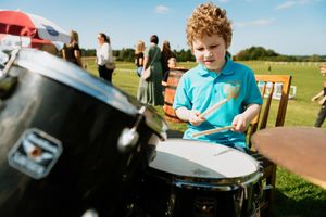 Having a go on the drums