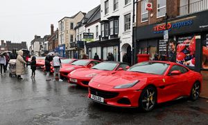 Visitors to the Bridgnorth Italian Moto Fest brave the horrendous downpours to view the cars on show