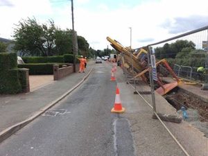 Supporting image for story: Digger collapses into trench at roadworks site