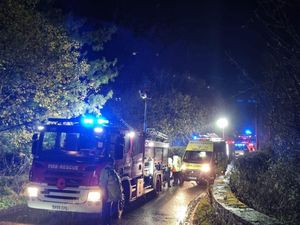 Supporting image for story: Firefighters rescue trapped person after convertible car crashes into Oswestry field
