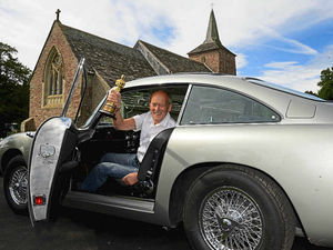 Supporting image for story: Video and pictures: Green fingers meet Goldfinger at church's Bond-themed flower festival
