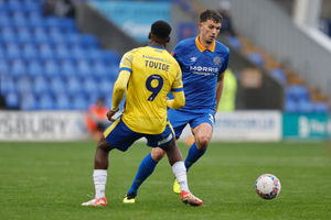 Tom Flanagan of Shrewsbury Town and Samson Tovide of Colchester United (AMA)