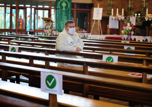 Father Craig Fullard demonstrates the seating arrangement for all services 