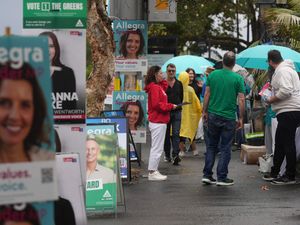 People arrive at a polling place as early voting begins in Sydney