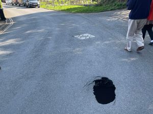 Supporting image for story: 'Very deep' sinkhole opens up in Shropshire town road