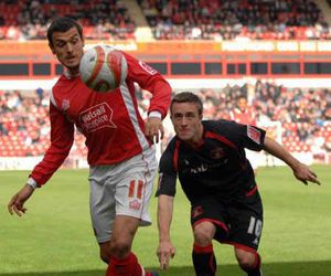 Walsall attacker Alex Nicholls has vowed to fight for his future at the Banks's Stadium after admitting he had considered a loan move.