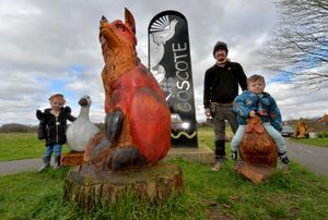 Robot Cossey with youngsters Dotty Cushman, three, and Isaac Boys, two