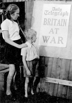 It starts here. Sylvia and Roger view the grim tidings on September 3, 1939.