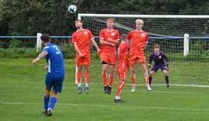Sport: AFC Bridgnorth v Smethwick Rangers (in orange).    B:George Shaw takes a free kick.