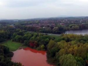 Supporting image for story: Pictures: Drone images show Telford fields covered in brown water after burst pipe
