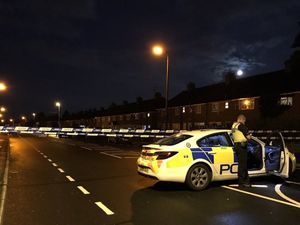 Police at the scene on Friar Park Road. Picture: John Kennett