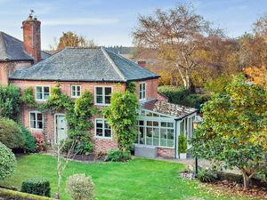 Supporting image for story: Stunning period cottage complete with sandstone footbridge and water feature hits the market