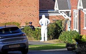 Forensic workers seen in Devereux Gardens, Great Haywood. 