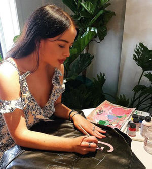 Making another of her pieces in her workshop
