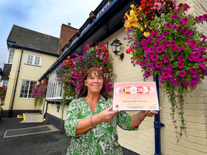 Supporting image for story: Landlady celebrates as her pub's hanging baskets win Wombourne in Bloom award