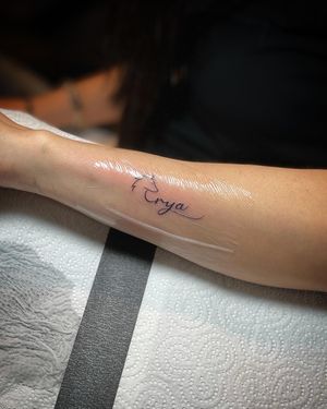 The tattoo is of the couple's daughter's name with a wolf head at the front Photo: Black Circle Tattoo Studio