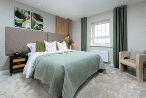 A bedroom in a show home at The Catkins development
