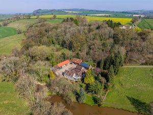 Supporting image for story: Stunning cottage overlooking expansive private lake and occupying 'secluded picturesque location' hits the market
