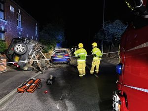 Supporting image for story: Land Rover left teetering 'precariously' on its side close to several properties after multi-vehicle crash