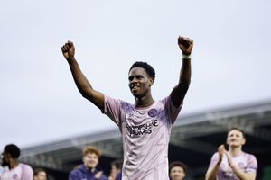 Trey Ogunsuyi celebrates after scoring 
