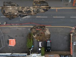 Supporting image for story: Sinkhole that wrecked Surrey street could take year to fix, residents told