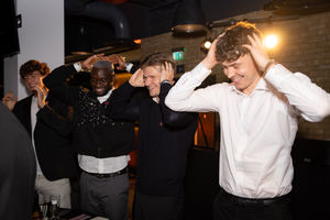 Wolves players enjoying a game of Heads & Tails at the Gala Dinner.