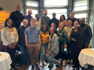 Shaun Escoffery(back left) with The Lion King senior cast, crew and media guests