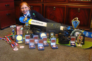Trophy time: Eight-year-old Amber shows off the spoils of her success.