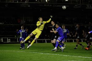 Bristol Rovers goalkeeper Brad Young clears