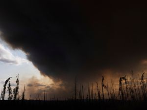 Supporting image for story: Thousands evacuated in Canadian provinces as wildfires threaten air quality