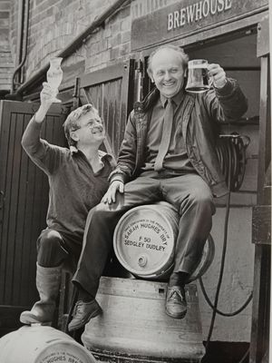 John Hughes, right, has died aged 87