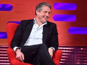 Supporting image for story: Hugh Grant revealed as tiny green and orange Oompa-Loompa in Wonka trailer