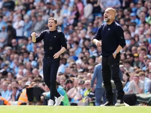 Crystal Palace manager Oliver Glasner and Manchester City boss Pep Guardiola on the touchline directing their teams during a game