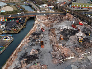 Supporting image for story: New drone picture of city site that was a raging inferno shows two month clean-up success