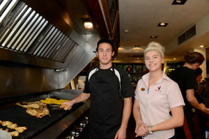 Tommy Rowe tends to the chicken