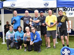 Supporting image for story: Teams paddle in the rain on The Mere for charity at popular boat regatta