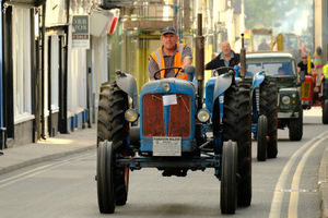 Gary Dickerson of Kington Vintage Club drives his Fordson Major tractor through town during the procession. Image by Andy Compton