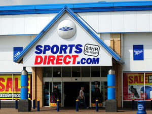 Supporting image for story: Sports Direct chain sees profits halved