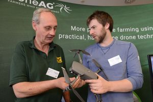 Jack Wrangham, right, from Drone Ag explains the operation of a drone to Chris Eglington from Crop Angel