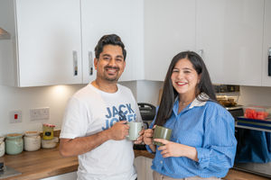 B&DWM - SGB-39299 - Saad and Tania relaxing in the kitchen of their David Wilson Home