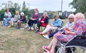 Members chat before the meeting