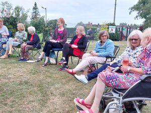 Supporting image for story: Garden meeting blossoms with friendship and laughter
