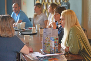 The families share a chat over coffee