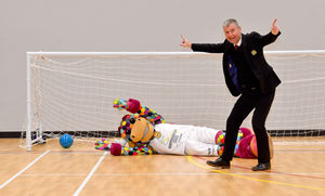 Denis Irwin fires in the first goal at the centre, as Perry the Commonwealth games mascot fails to make the save