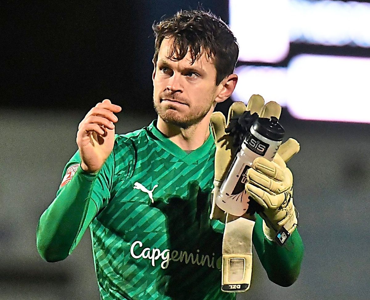 Telford midfielder called into action after goalkeeper Brandon Hall injury two minutes into game against Peterborough Sports